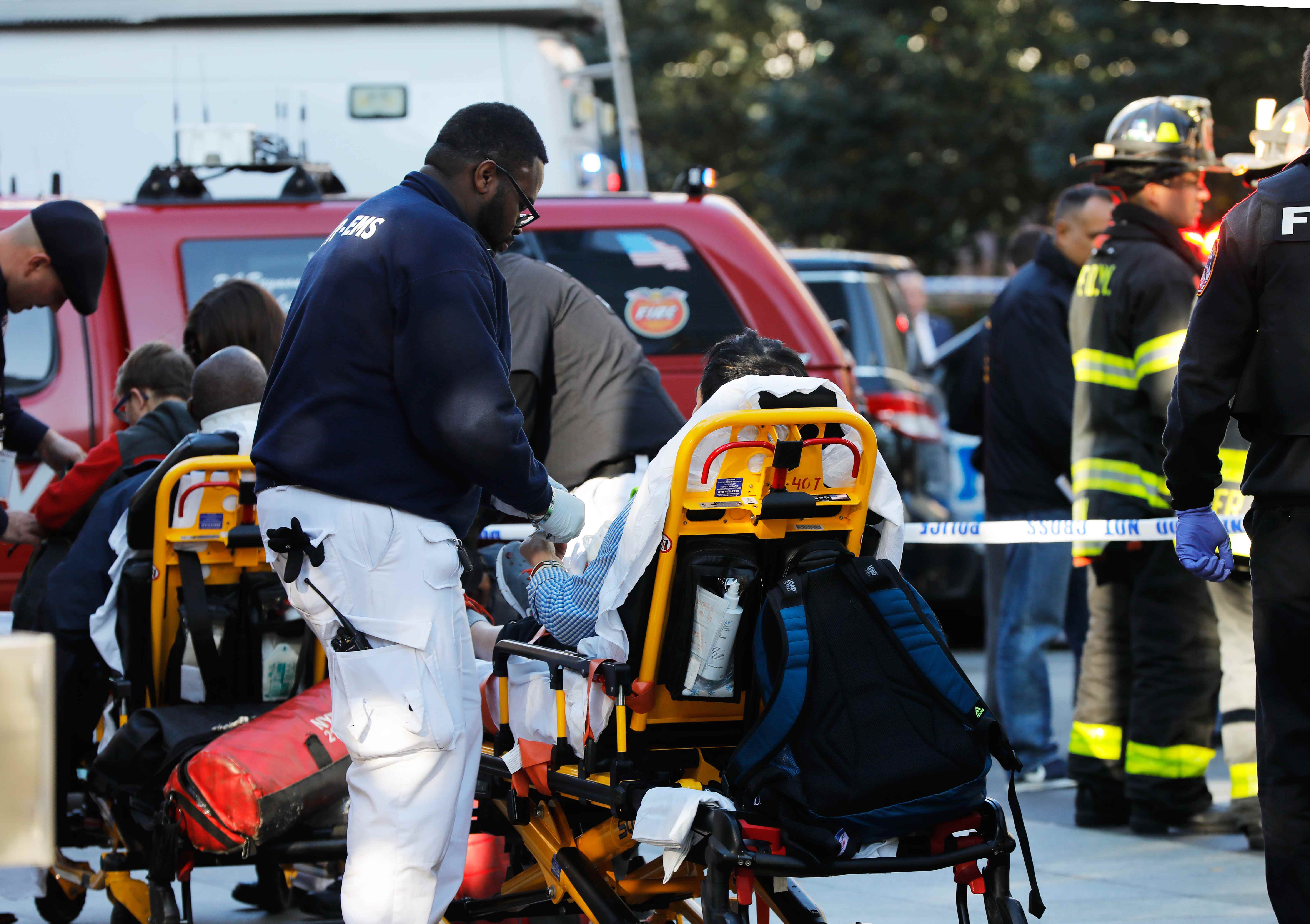 First responders tend to a victim after a shooting incident in New York City