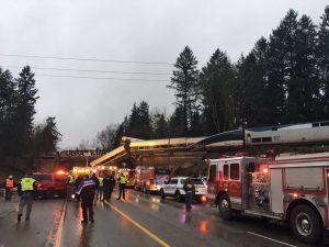 First responders are seen at the scene of an Amtrak passenger train derailment on interstate highway (I-5) in this Washington State Patrol image moved on social media in DuPont, Washington, U.S., December 18, 2017. Courtesy