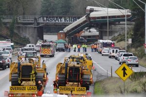 Rescue personnel and equipment are seen at the scene where an Amtrak passenger train derailed on a bridge over interstate highway I-5 in DuPont, Washington, U.S., December 18, 2017.