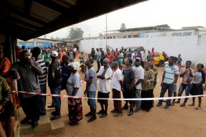 People wait to vote during the presidential election at a polling station in Monrovia, Liberia December 26, 2017.
