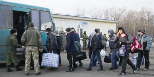 Prisoners of war (POWs) from the separatist self-proclaimed Luhansk People's Republic (LNR) board a bus during the exchange of captives near the city of Bakhmut in Donetsk region, Ukraine December 27, 2017.