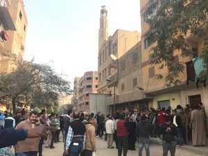 People are seen outside the Mar Mina Church after a blast, in Helwan district on the outskirts of Cairo, Egypt after a blast December 29, 2017.