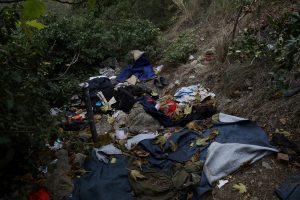 Discarded clothes are seen by a mountain pass near the Italian-French border from where migrants have attempted to pass into France, near the Mediterranean coastal town of Ventimiglia in northern Italy,