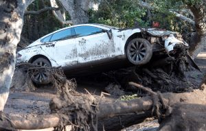 A car sits tangled in debris after being destroyed by mudslides in Montecito, California, U.S., January 10, 2018.