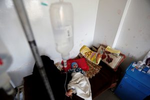 A child lies in a bed at a hospital in Sanaa, Yemen January 16, 2018
