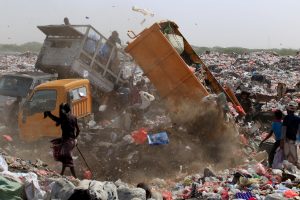 People collect recyclables and food at a garbage dump near the Red Sea port city of Hodeidah, Yemen, January 14, 2018.