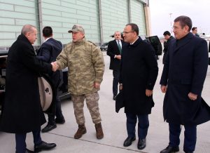 Turkish President Tayyip Erdogan is welcomed by Chief of the General Staff Hulusi Akar, Deputy Prime Minister Bekir Bozdag and Defence Minister Nurettin Canikli upon his arrival at the border city of Hatay, Turkey January 25, 2018.
