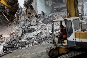 An excavator demolishes collapsed Marshal hotel after an earthquake hit Hualien, Taiwan February 9, 2018.