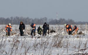 Russian Emergency Situations Ministry members work at the crash site of the short-haul AN-148 airplane operated by Saratov Airlines in Moscow Region, Russia February 12, 2018.