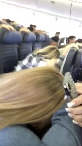 Passengers brace during the plane landing in Honolulu, Hawaii, U.S., February 13, 2018 in this still image taken from a social media video. Mariah Amerine/via REUTERS