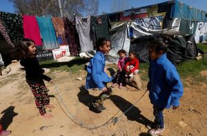 Syrian refugee children play at a tented settlement in the town of Qab Elias, in Lebanon's Bekaa Valley, March 13, 2018. REUTERS/Mohamed Azakir