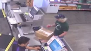 A surveillance image shows the serial bombing suspect inside a FedEx office store in Austin, Texas, U.S., which was given to law enforcement and obtained by TV station, WOAI/KABB, March 21, 2018. Courtesy of WOAI/KABB/Handout via Reuters