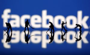 Figurines are seen in front of the Facebook logo in this illustration taken March 20, 2018. REUTERS/Dado Ruvi