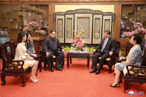 North Korean leader Kim Jong Un and wife Ri Sol Ju, and Chinese President Xi Jinping and wife Peng Liyuan meet, as Kim Jong Un paid an unofficial visit to Beijing, China, in this undated photo released by North Korea's Korean Central News Agency (KCNA) in Pyongyang March 28, 2018. KCNA/via Reuters