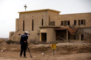 A sapper belonging to the HALO Trust, an international landmine clearance charity, looks for old mines in an abandoned church property complex near Qasr Al-Yahud, a traditional baptism site along the Jordan River, near Jericho in the occupied West Bank, March 29, 2018.