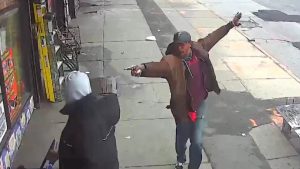 Saheed Vassell points a metal pipe at a pedestrian in Brooklyn April 4, 2018, in a still image from surveillance video released by the New York Police Department in New York City, New York, U.S. on April 5, 2018. NYPD/Handout via REUTERS