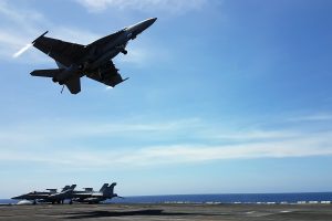 An F18 fighter takes off from the deck of the USS Theodore Roosevelt while transiting the South China Sea April 10, 2018. REUTERS/Karen Lema