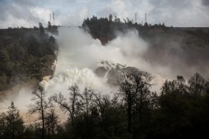 FILE PHOTO: 65,000 cfs of water flow through a damaged spillway on the Oroville Dam in Oroville, California, U.S., February 10, 2017. REUTERS/Max Whittaker/File Photo