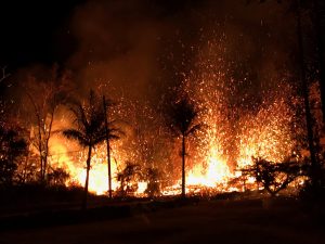 A new fissure spraying lava fountains as high as about 230 feet (70 m), according to United States Geological Survey, is shown from Luana Street in Leilani Estates subdivision on Kilauea Volcano's lower East Rift Zone in Hawaii, U.S., May 5, 2018. US Geological Survey/Handout via REUTERS