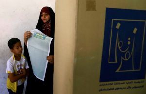A female security member casts her vote at a polling station two days before polls open to the public in a parliamentary election in Baghdad, Iraq May 10, 2018. REUTERS/Thaier al-Sudani