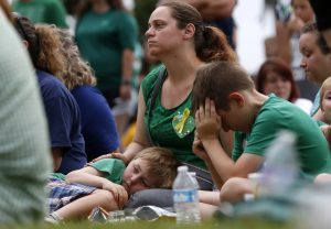 Mourners attend a vigil in memory of the victims killed in a shooting at Santa Fe High School in League City, Texas, U.S., May 20, 2018. REUTERS/Jonathan Bachman