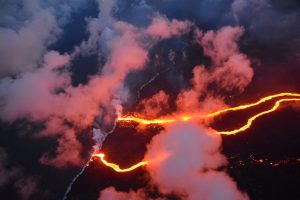 Lava flows are seen entering the sea along the coastline during ongoing eruptions of the Kilauea Volcano May 23, 2018. USGS/J. Ozbolt, Hilo Civil Air Patrol/Handout via REUTERS