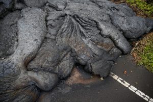 Lava covers Pohoiki Road near Pahoa, Hawaii, U.S., May 29, 2018. REUTERS/Marco Garcia