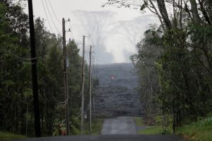 The Kilauea lava flow cuts off Kahukai Street, in the Leilani Estates near Pahoa, Hawaii, U.S., May 29, 2018. REUTERS/Marco Garcia