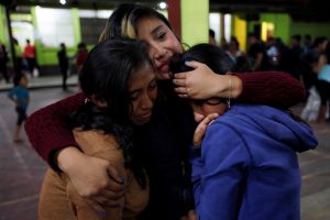 Women react inside a shelter after Fuego volcano erupted violently in San Juan Alotenango, Guatemala June 3, 2018. REUTERS/Luis Echeverria