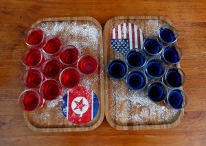 FILE PHOTO: Special red and blue shots offered at Escobar bar to mark the summit meeting between U.S. President Donald Trump and North Korean leader Kim Jong Un, are displayed on a table in Singapore June 4, 2018. REUTERS/Edgar Su/File Photo