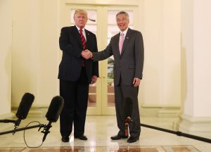 U.S. President Donald Trump and Singapore's Prime Minister Lee Hsien Loong shake hands during a meeting at the Istana in Singapore June 11, 2018. REUTERS/Jonathan Ernst