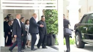 U.S. President Donald Trump shows North Korean leader Kim Jong Un his car, nicknamed "The Beast", during their walk around Capella hotel after a working lunch at a summit in Singapore, June 12, 2018, in this still image taken from video. Host Broadcaster/via REUTERS ATTENTION EDITORS - THIS IMAGE WAS PROVIDED BY A THIRD PARTY. NO RESALES. NO ARCHIVES. BROADCASTERS: NO USE AFTER 72 HOURS; DIGITAL: NO USE AFTER 30 DAYS.