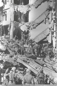 FILE PHOTO: Rescue workers are seen at the site of the King David Hotel in Jerusalem which has served as the British headquarters, and was bombed by Jewish Irgun paramilitary group killing more than 90 people, in this July 22, 1946 file photo released by the Israeli Government Press Office (GPO) and obtained by Reuters on June 18, 2018. GPO/Hugo Mendelson/Handout via REUTERS/File Pho