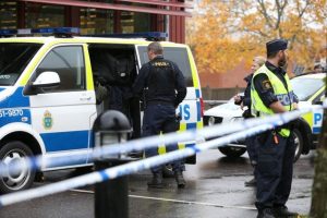 FILE PHOTO: Police officers stand guard at a cordoned area after a masked man attacked people with a sword at a school in Trollhattan, western Sweden October 22, 2015. REUTERS/Bjorn Larsson Rosvall/TT News Agency/File Photo