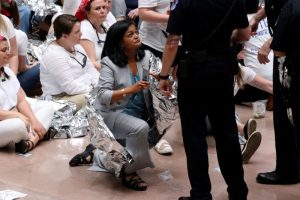 U.S. Capitol Police direct U.S. Representative Pramila Jayapal (D-WA) to stand for arrest as she joined demonstrators calling for "an end to family detention" and in opposition to the immigration policies of the Trump administration, at the Hart Senate Office Building on Capitol Hill in Washington, U.S. June 28, 2018. REUTERS/Jonathan Ernst