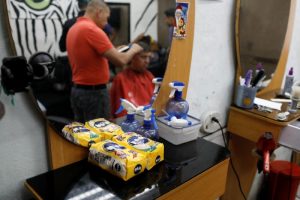 Packages of corn flour used as payment for haircuts are seen in a barber shop in Caracas, Venezuela June 29, 2018. REUTERS/Marco Bello
