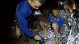 Boys from the under-16 soccer team trapped inside Tham Luang cave receive treatment from a medic in Chiang Rai, Thailand, in this still image taken from a July 3, 2018 video by Thai Navy Seal. Thai Navy Seal/Handout via REUTERS TV