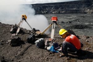 Kelly Wooten, a geologist and volcanologist at Hawaiian Volcano Observatory (HVO) is downloading radiometer data on rim of Halema‘uma‘u Crater in Kilauea Volcano, Hawaii, U.S., December 19, 2008. Picture taken on December 19, 2008. Courtesy USGS/Handout via REUTERS