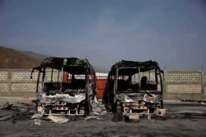 Two burnt buses are seen inside the customs facilities in Malpasse, Haiti, July 8, 2018. REUTERS/Andres Martinez Casares