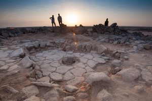 A stone structure at an archeological site containing a fireplace, seen in the middle, where charred remains of 14,500-year-old bread was found in the Black Desert, in northeastern Jordan in this photo provided July 16, 2018. Alexis Pantos/Handout via REUTERS