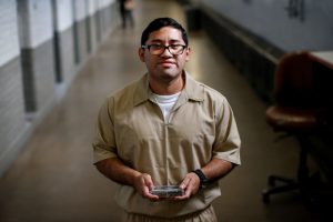 Inmate Ignacio Rodriguez poses while using his JPay tablet device inside the East Jersey State Prison in Rahway, New Jersey, U.S., July 12, 2018. REUTERS/Brendan McDermid