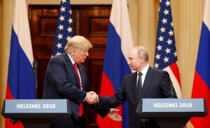 FILE PHOTO: U.S. President Donald Trump and Russian President Vladimir Putin shake hands as they hold a joint news conference after their meeting in Helsinki, Finland July 16, 2018. REUTERS/Grigory Dukor