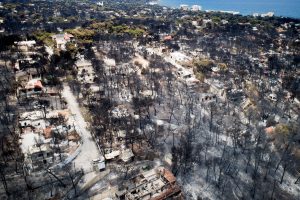 An aerial view shows burnt houses and trees following a wildfire in the village of Mati, near Athens, Greece, July 25, 2018. Antonis Nicolopoulos/Eurokinissi via REUTERS