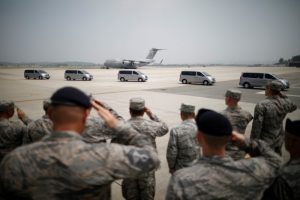 U.S. soldiers salute to vehicles transporting the remains of 55 U.S. soldiers who were killed in the Korean War at Osan Air Base in Pyeongtaek, South Korea, July 27, 2018. REUTERS/Kim Hong-Ji/Pool