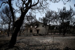 FILE PHOTO: A burnt house is seen following a wildfire in the village of Mati, near Athens, Greece, July 28, 2018. REUTERS/Costas Baltas/File Photo