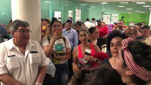 People wait in the Durango Airport after an Aeromexico-operated Embraer passenger jet crashed right after takeoff in Mexico's state of Durango, July 31, 2018, in this picture obtained from social media. Contacto Hoy/via REUTERS