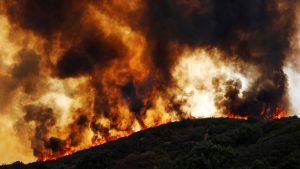 Wind-driven flames roll over a hill towards homes during the River Fire (Mendocino Complex) near Lakeport, California, U.S. August 2, 2018. REUTERS/Fred Greaves