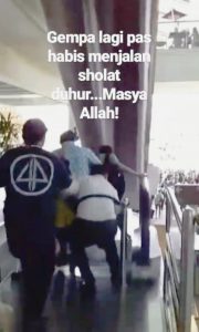 People are seen running out of Bali's Ngurah Rai International Airport, Indonesia August 9, 2018 in this still image taken from a video obtained from social media. DOY SAFANDO BALI/via REUTERS