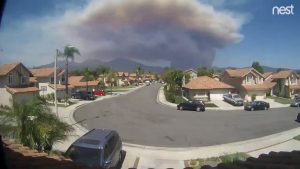 FILE PHOTO: A still frame taken from a timelapse video sourced from social media dated August 6, 2018 shows the Holy Fire as seen from Rancho Santa Magarita, California, U.S. ARTHUR WHITING/via REUTERS