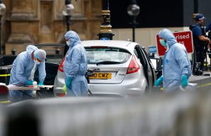 Forensic investigators work at the site after a car crashed outside the Houses of Parliament in Westminster, London, Britain, August 14, 2018. REUTERS/Henry Nicholls